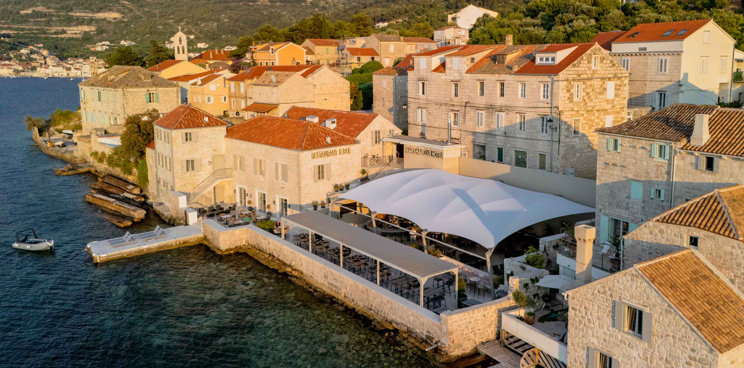 Located on the waterfront with breathtaking views of Vis harbor, Marshal Club Hotel offers a unique setting where island relaxation meets elegant ambiance